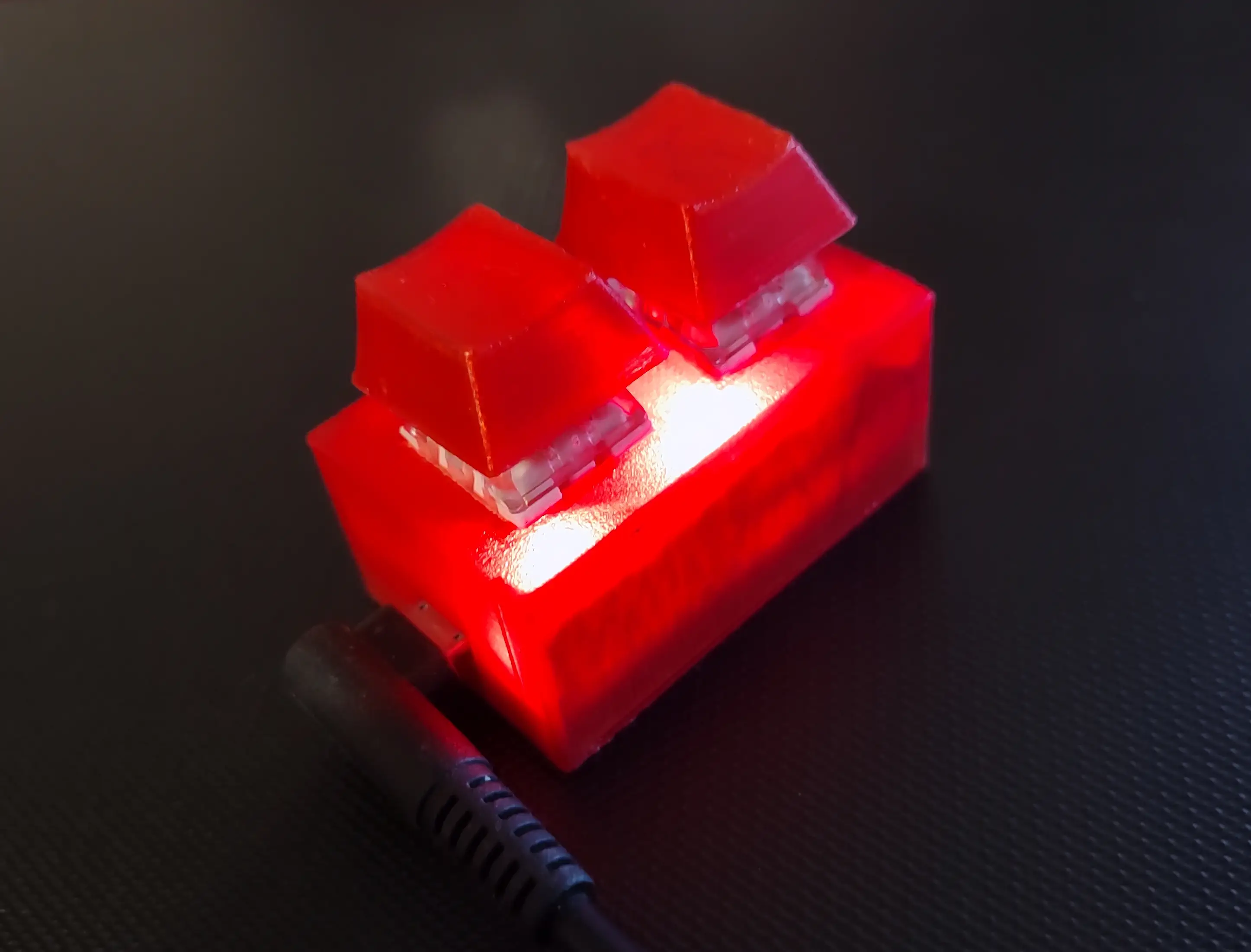 Picture of the 2 key keypad 3D printed in red filament with kalih box brown key switches.